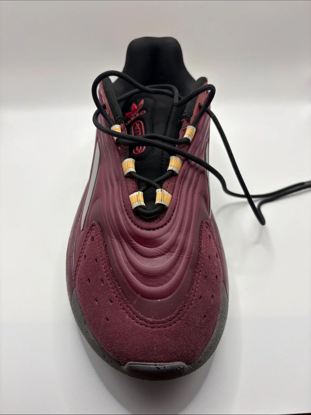 adidas OZELIA Men’s Burgundy and Black Running Sneaker with Yellow Accents